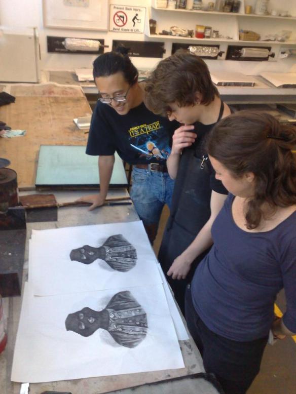Student assistants at Cicada Press - Angela Butler, Jack Nibs and Jason Phu examine the proofs
